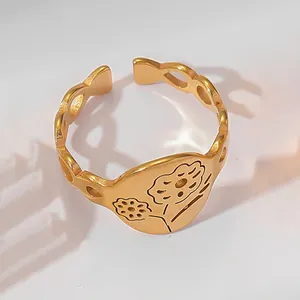 Detailed macro view of 18k gold plated stainless steel ring with floral engravings