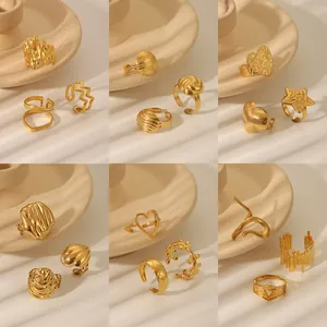 Collection of golden stainless steel rings with lava texture and minimalist geometric designs