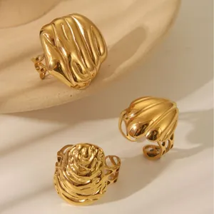 Three-piece gold stainless steel rings set featuring textured relief designs and open band
