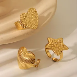 Three-piece gold stainless steel open ring set featuring heart and star texture designs