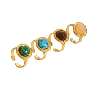 Set of four 18K gold plated stainless steel rings featuring colorful geometric stones