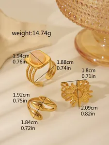 Detailed view of three 18k gold plated rings featuring pink gemstones and wheat leaf design