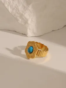 Detail of 18K gold plated stainless steel ring featuring vintage turquoise setting