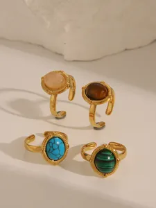 Set of 4 gold-plated stainless steel rings with colorful turquoise and tiger eye stones