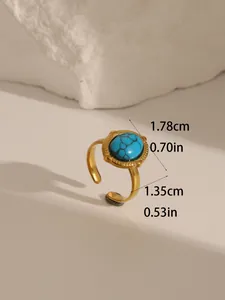 Detail of 18k gold plated stainless steel ring with turquoise stone inlay and bead trim
