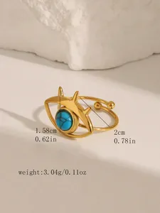 Detailed view of evil eye open ring with turquoise inlay and gold plated spikes