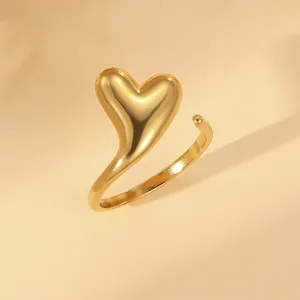 Detailed close-up of 18k gold plated stainless steel open ring with a 3D heart design