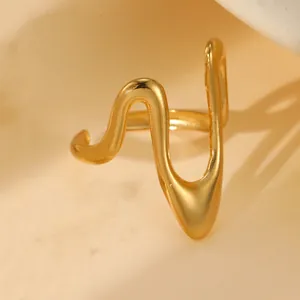 Macro view of 18k gold plated stainless steel ring with minimalist irregular wave design