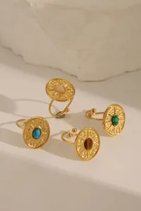Detailed view of 18k gold plated stainless steel rings with colorful turquoise stones