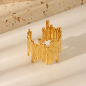 Detailed view of the irregular molten texture on this gold-plated stainless steel ring