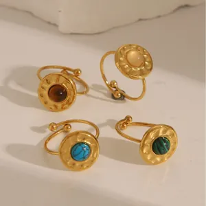 Set of four 18k gold plated stainless steel open rings with assorted round gemstones