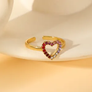 Macro shot of gold adjustable ring featuring a heart-shaped gradient zircon setting