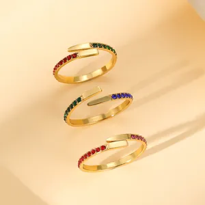 Three-piece gold plated open rings set with colorful zircons in a minimalist style