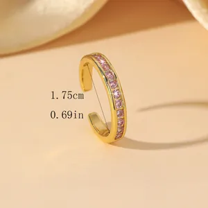 Detailed close-up of gold ring with pink zircon inlay and 1.75cm diameter measurements