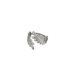 Detailed close-up of a silver leaf pattern ring in adjustable stainless steel design