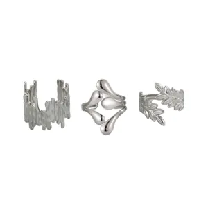 Three-piece silver stainless steel rings set featuring irregular lava and leaf patterns