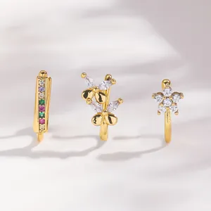 Three gold non-pierced nose clips with colorful zircon stones in a stylish jewelry set