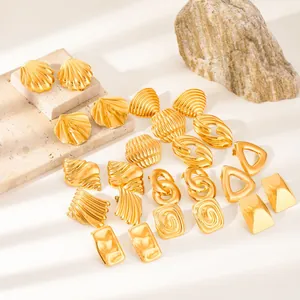 Collection of geometric 18k gold plated stainless steel stud earrings on stone bases