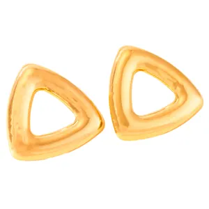 Macro shot of polished gold-plated stainless steel triangle earrings with a hollow design