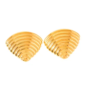 Macro view of gold plated stainless steel fan earrings with textured ripple pattern