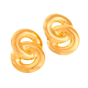 Close-up of interlinked 18k gold-plated stainless steel hoop earrings in a 8-shape design
