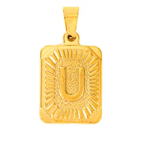 Detail of gold rectangular pendant featuring letter U with textured finish and radiant edges