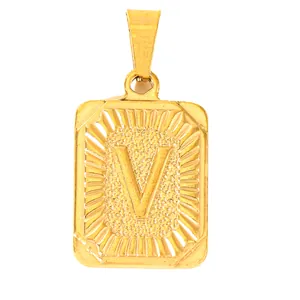 Macro shot of gold-plated rectangular pendant with embossed letter V and textured finish