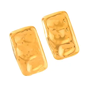 Macro detail of 18k gold plated earrings featuring a modern hammered metal texture