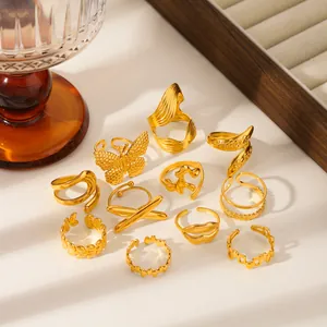Set of 11 gold-plated adjustable rings with butterfly, wave, and geometric patterns