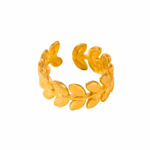 Detailed close-up of a gold-plated adjustable olive leaf ring with a textured finish