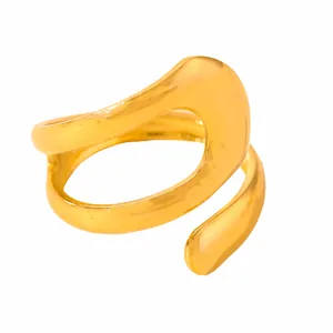 Detailed macro view of an irregular geometric gold-plated stainless steel open ring design