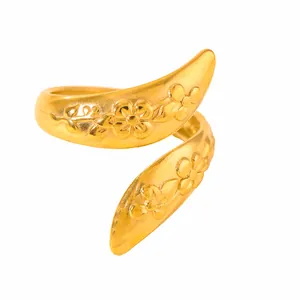 Detailed view of adjustable gold plated ring featuring spiral design with floral relief