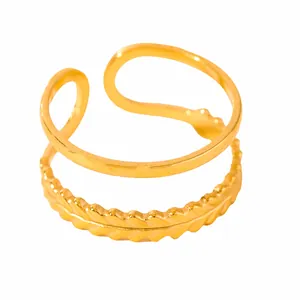 Detail of gold-plated double-layer open ring featuring smooth and textured wavy bands