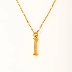 Detail of 18k gold plated letter I pendant with unique vertical textured wood grain finish