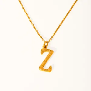 Detailed view of 18k gold plated letter Z pendant with hammered bark texture on chain