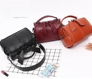 Trio of Boston bags in black, burgundy and brown with lychee texture and wide straps