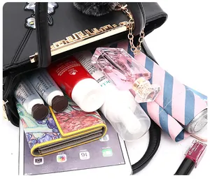 Macro shot showing large capacity of floral embroidery tote bag with personal essentials