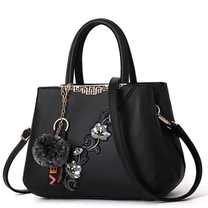 Large capacity black floral embroidered handbag for women with adjustable strap and charm