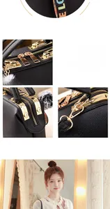 Detail view of black lychee leather bag with gold hardware and colorful webbing strap