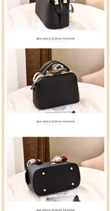 Detail view of black lychee leather bag showing gold zippers, side decor, and base studs