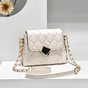 Elegant white quilted chain crossbody bag with black and gold geometric metal clasp buckle