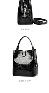 Detail view of glossy crocodile pattern bucket bag showing side and back profile