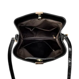 Elegant black crocodile pattern bucket bag with multiple compartments and gold hardware