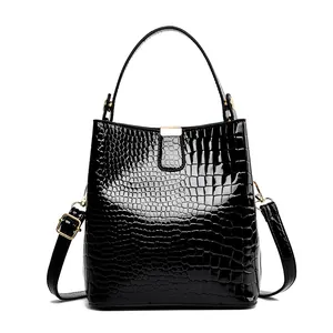 Glossy black crocodile pattern bucket bag with gold hardware and top handle for women