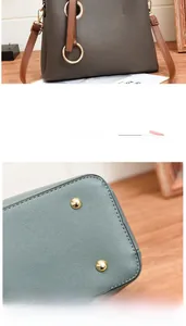 Detail view of large grey PU leather handbag with gold studs and textured finish