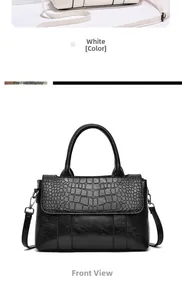 Détail de l'embossage motif crocodile sur sac à main en cuir souple avec ferrures argentées