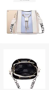 Internal compartments and size comparison of the color-block bucket bag with iPad