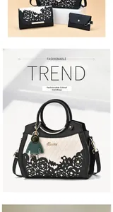 Detail of hollow floral patterns and pearl embellishments on the PU leather handbag