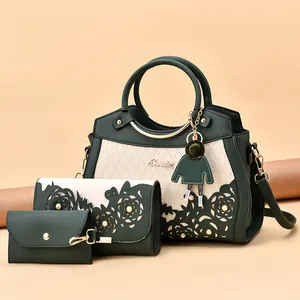 Three-piece dark green and beige tote bag set with hollow pattern and doll charm