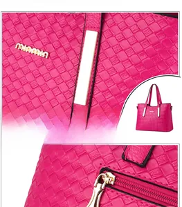 Dettaglio borsa shopper intrecciata rosso rosa con finiture metalliche dorate lucide